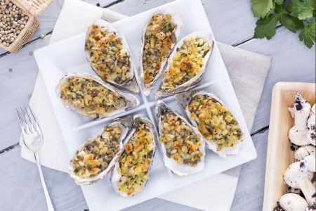 Gegratineerde oesters met paddenstoelen