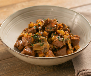 Kalfsstoofpot met pompoen, aardappelen en paddenstoelen