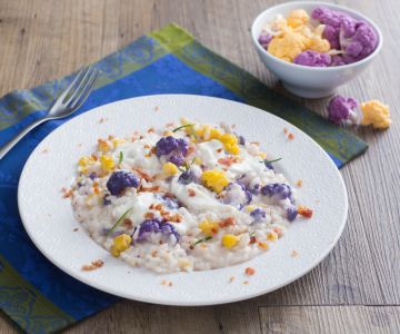 Risotto met gekleurde bloemkolen, stracciatella en guanciale