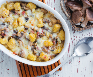 Gegratineerde gnocchi met paddenstoelen
