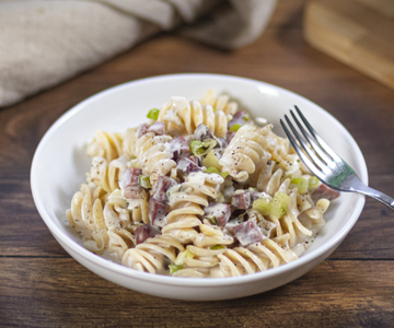 Pasta met robiola en speck