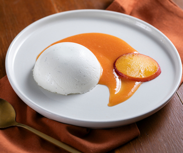 Panna cotta met perziken-coulis
