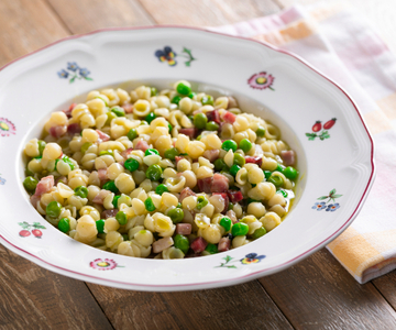 Pasta met doperwten en pancetta